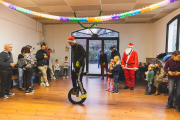 France, Monfaucon, 2022-12-17. Inhabitants of a small village near Tarbes in Occitania are welcoming Santa Claus and a juggler elf, for the Children's Christmas Party organized by the town hall and festival committee of the municipality of Monfaucon (65). Photograph by Sophie BELLARD / Hans Lucas.France, Monfaucon, 2022-12-17. Les habitants d un petit village pres de Tarbes en Occitanie accueillent le pere Noel et un lutin jongleur pour le Noel des enfants organise par la mairie et le comite des fetes de la municipalite de Monfaucon (65). Photographie par Sophie BELLARD / Hans Lucas.